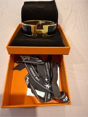 Hermès Clic Clac H Bracelet in Black and Gold